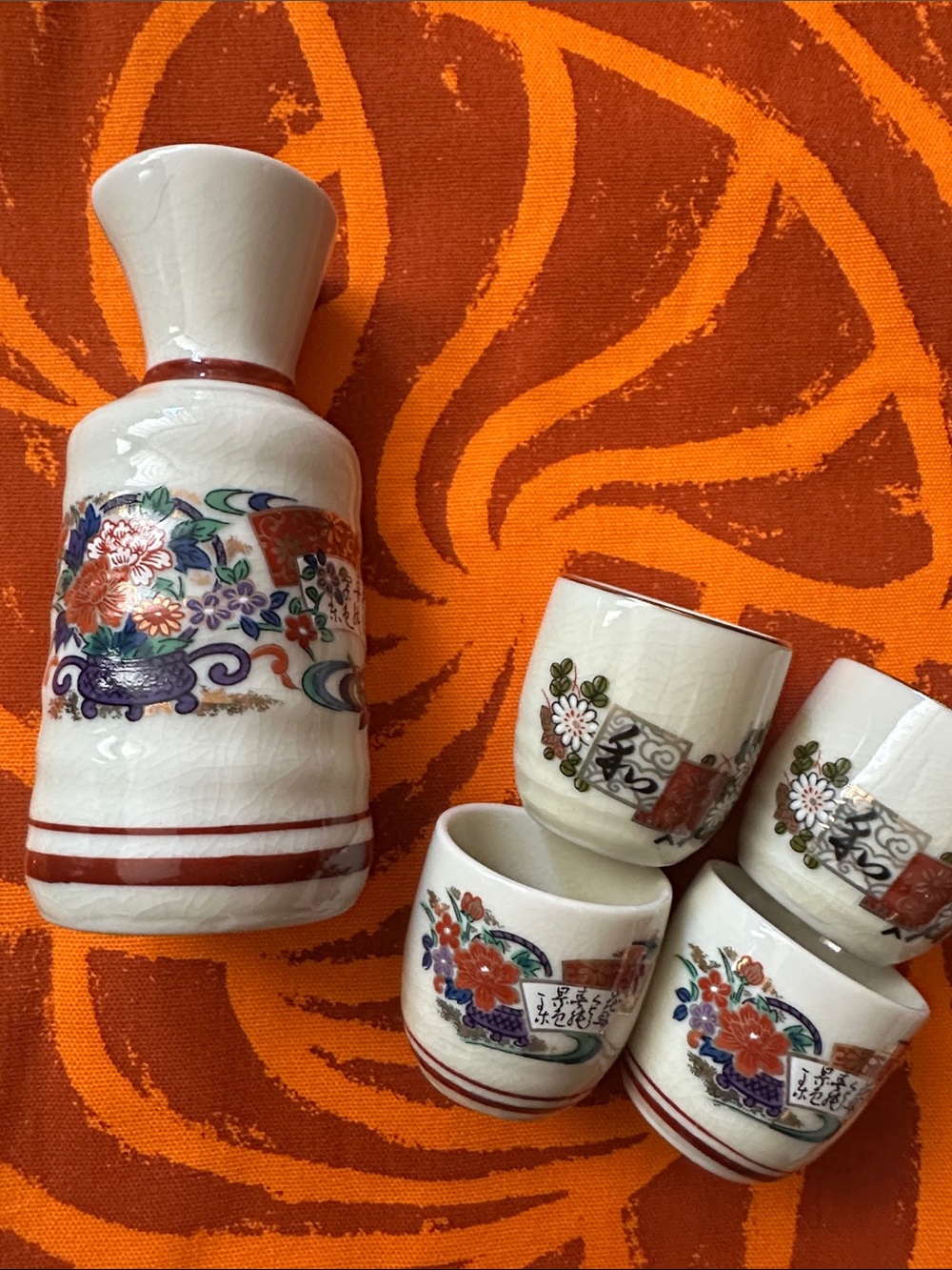 Traditional White Ceramic Sake Set with Red Floral Accents